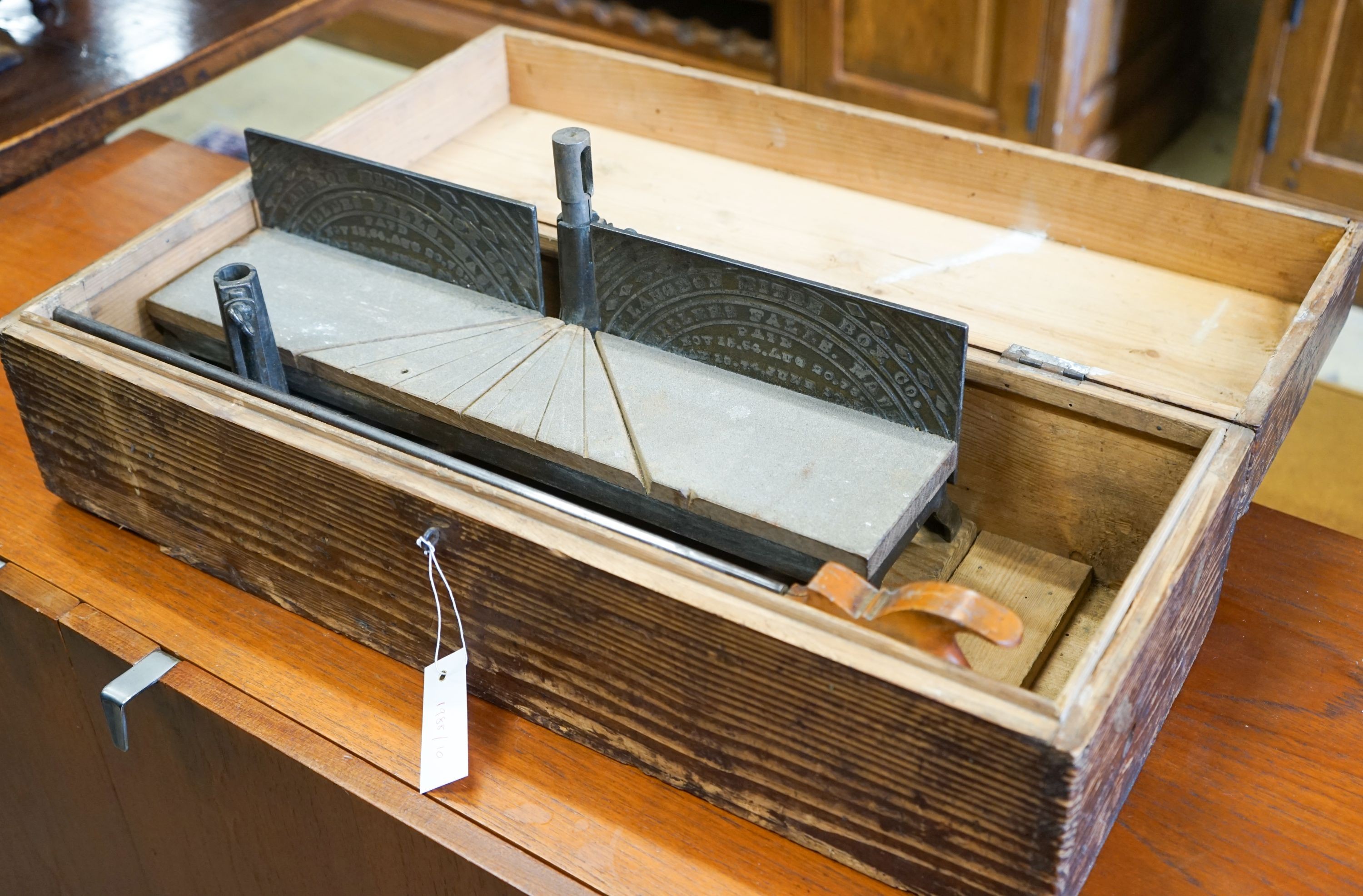 An early 20th century pine cased mitre saw, marked London Mitre Box Company